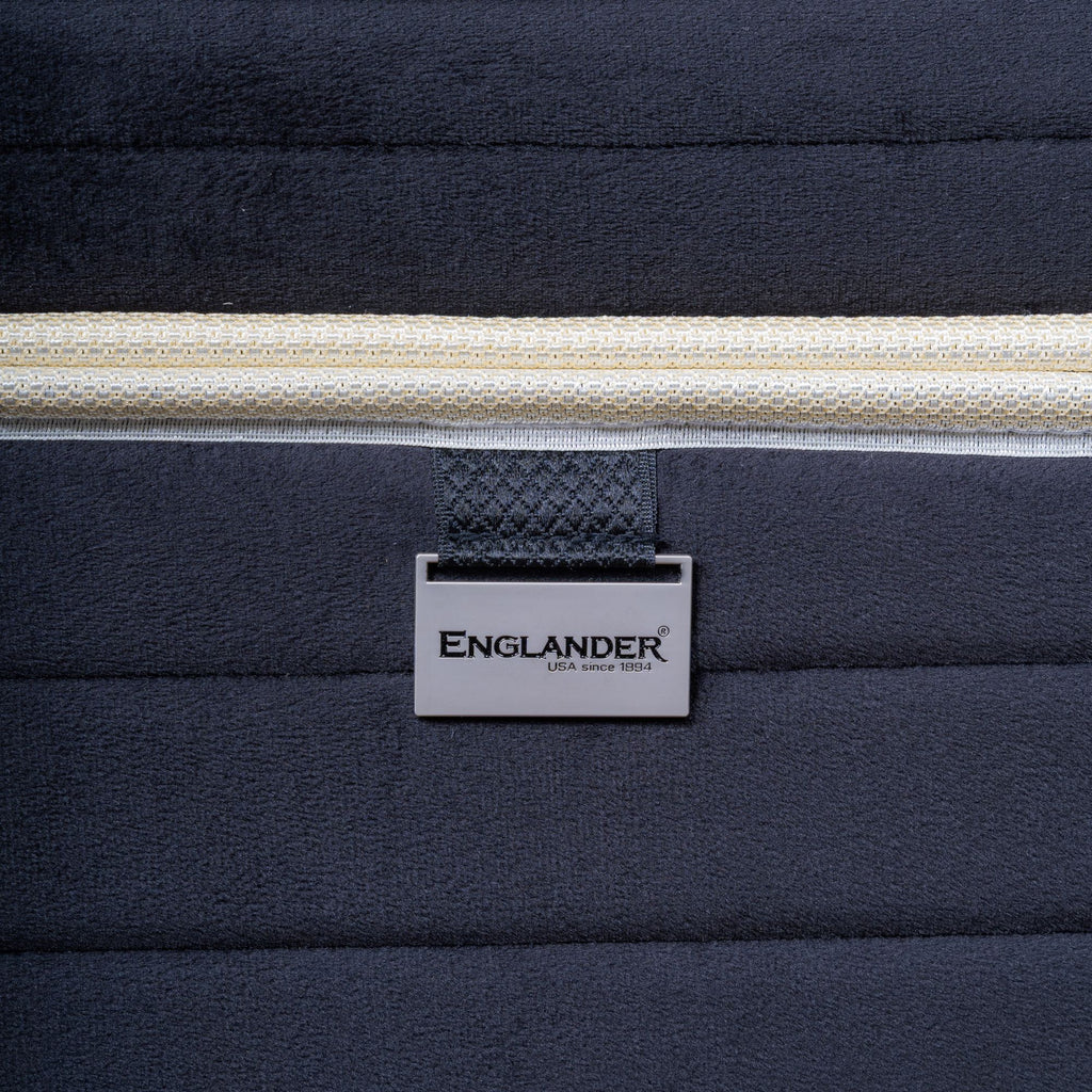Navy blue mattress showing 'Englander' brand logo.