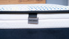 Close-up of a branded product with 'Englander' logo on a Metal Tag attached to one side of Englander Bettercare Mattress.