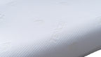 Close-up of a white textured pillow surface with subtle embossed branding and a dimpled fabric pattern.