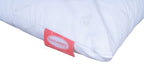 A close-up of a white Soft pillow with a red fabric tag on the side. The tag has a white oval label with the brand name 'ENGLANDER' printed in red.