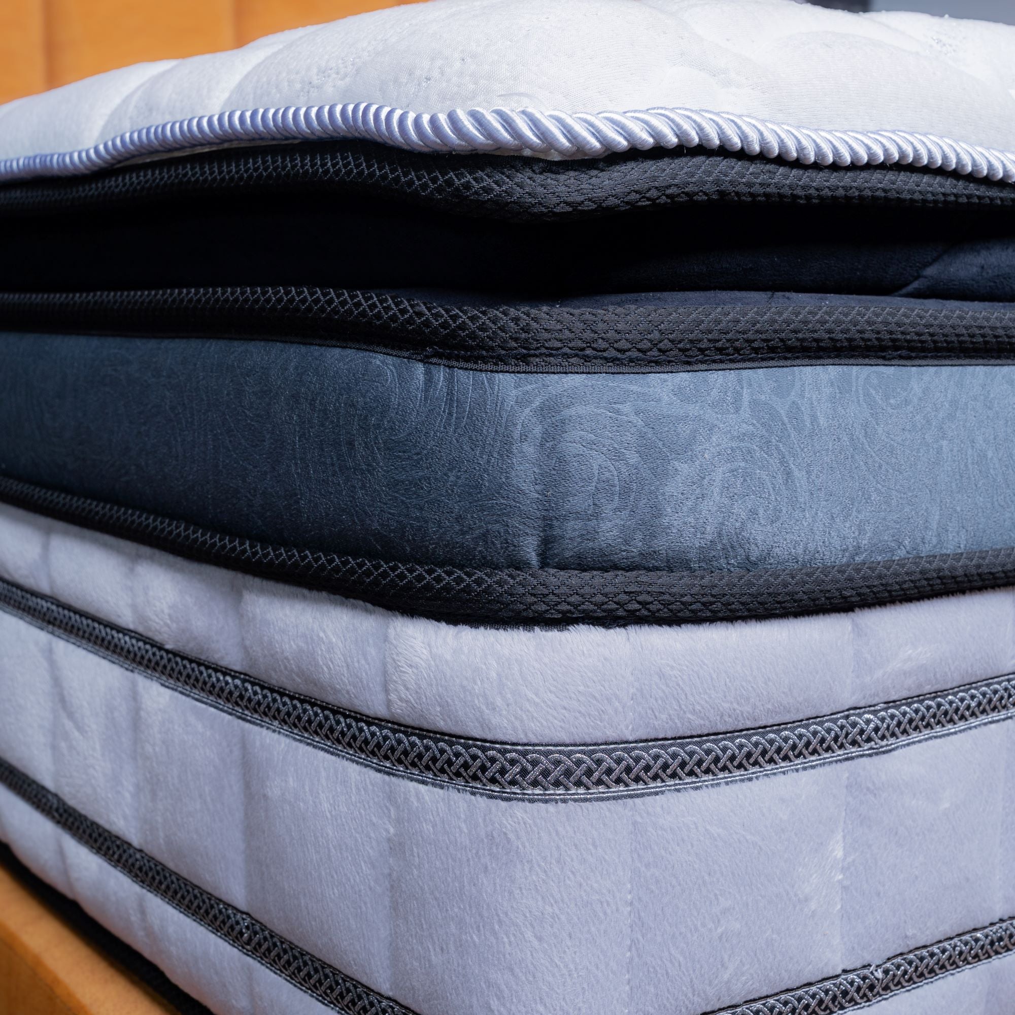 Stack of mattress toppers with visible stitching details