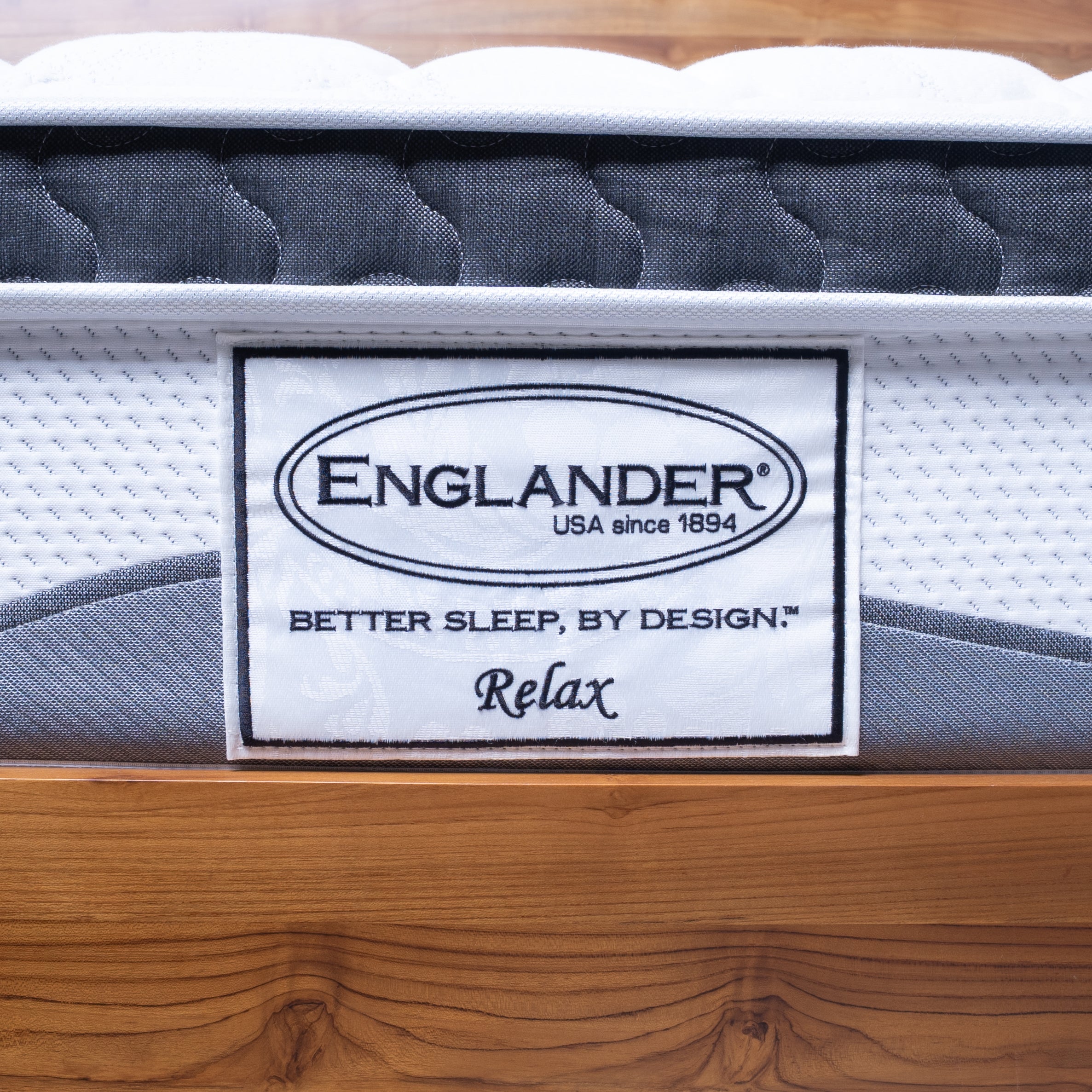 Englanders Resort Relax Mattress with 'Englander' brand label on a wooden base