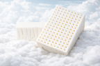 Illustration of perforated PlushRest latex blocks resting on soft white fibres.