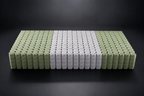 Illustration of a SpinalSupport pocket spring coil unit with green outer zones and a white centre zone.