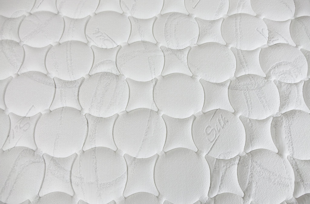 Close up of  Englanders Hotel 1984 Mattress Surface with writing silk on the surface